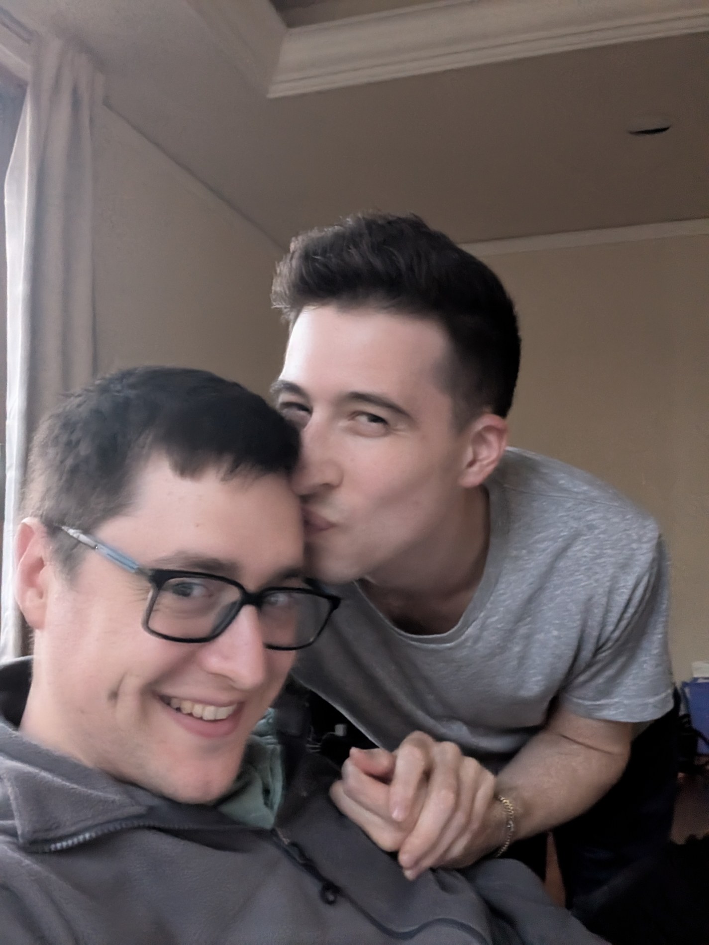 A kiss on the cheek during a quiet moment at home